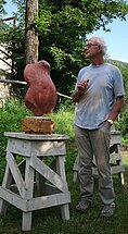 Sculpture of red Persian travertine