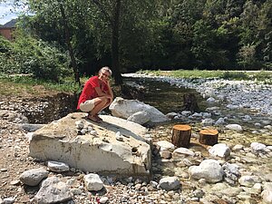 Searching for a stone at the river