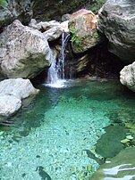 Recreation and refreshing bath in the marble river Serra